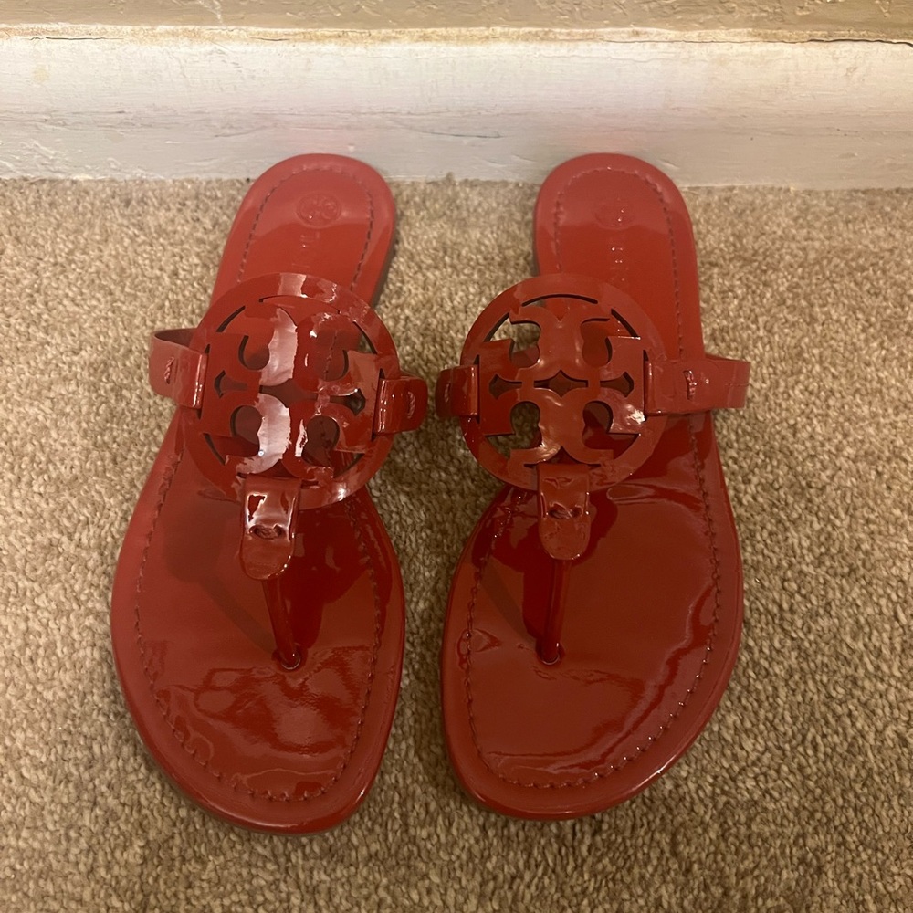Authentic brand new Tory Burch red sandals. Never worn NWOB. Size 7.5.